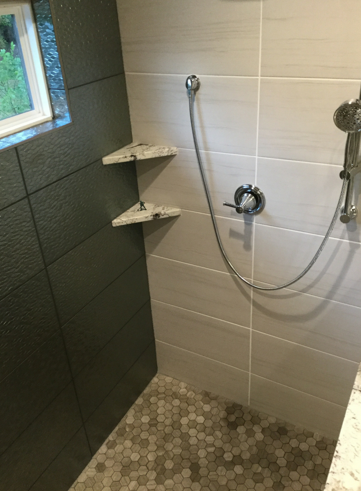 Large format ceramic tiles in an upscale tile shower | Innovate Building Solutions
