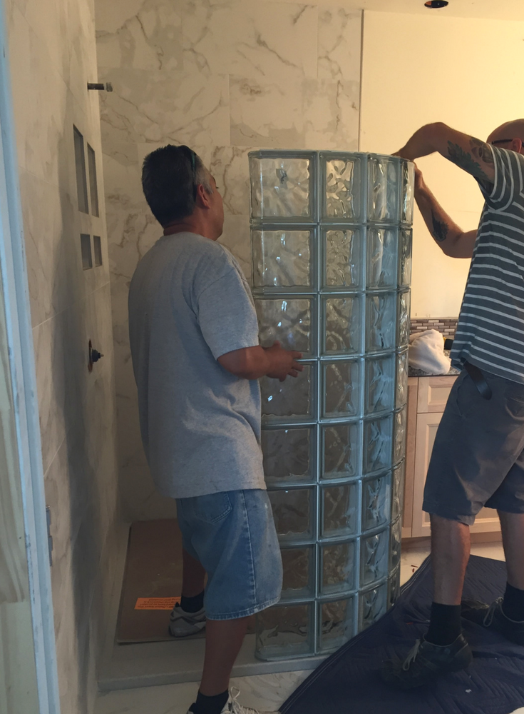 Premade curved glass block shower wall sections installed by do it yourselfers simply stack on top of each other like LEGO blocks | Innovate Building Solutions