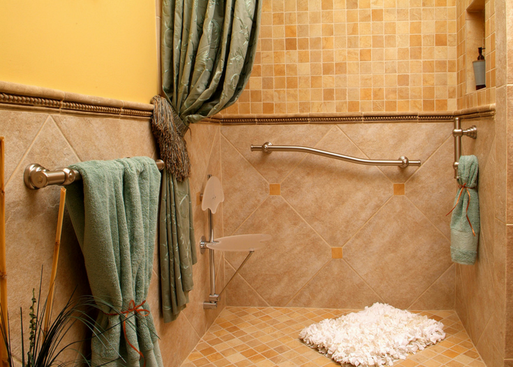 Stylish roll in shower with curved decorative grab bars and herringbone ceramic tile - Innovate Building Solutions 