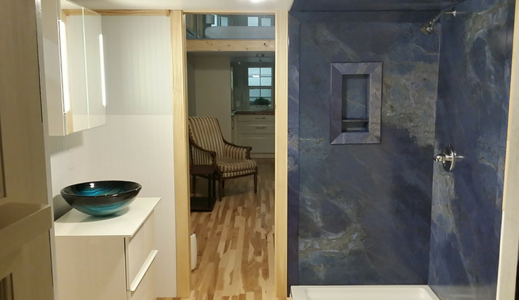 Decorative blue sodalite faux stone wall panels in a tiny home in North Carolina - Innovate Building Solutions