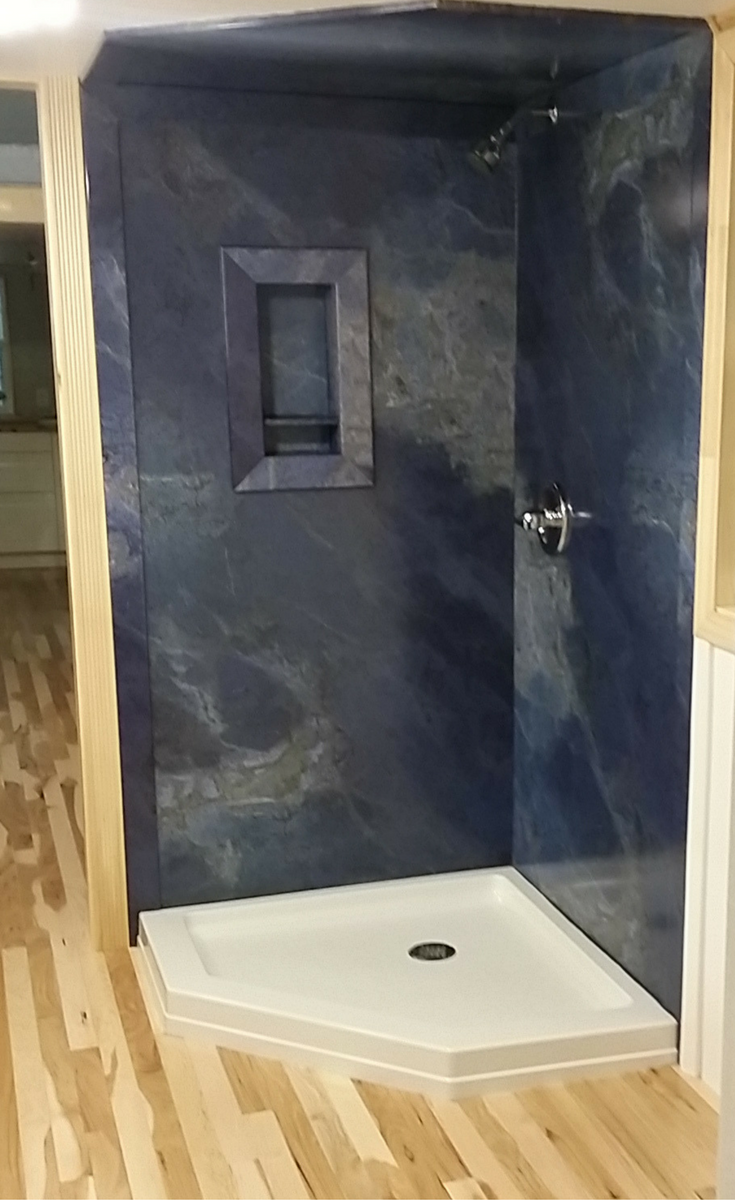 Faux granite shower wall panels in blue color with a ceiling panel - Innovate Building Solutions 