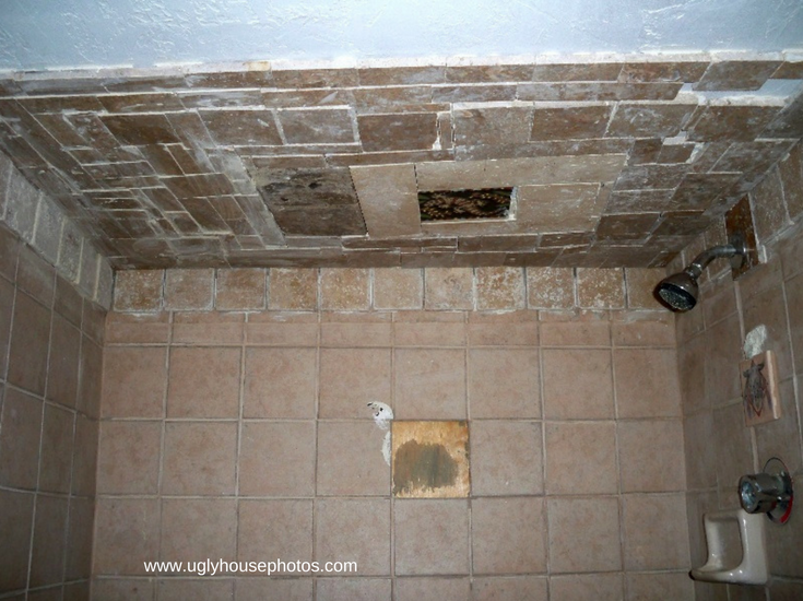 Really bad DIY tile shower with tiles falling off