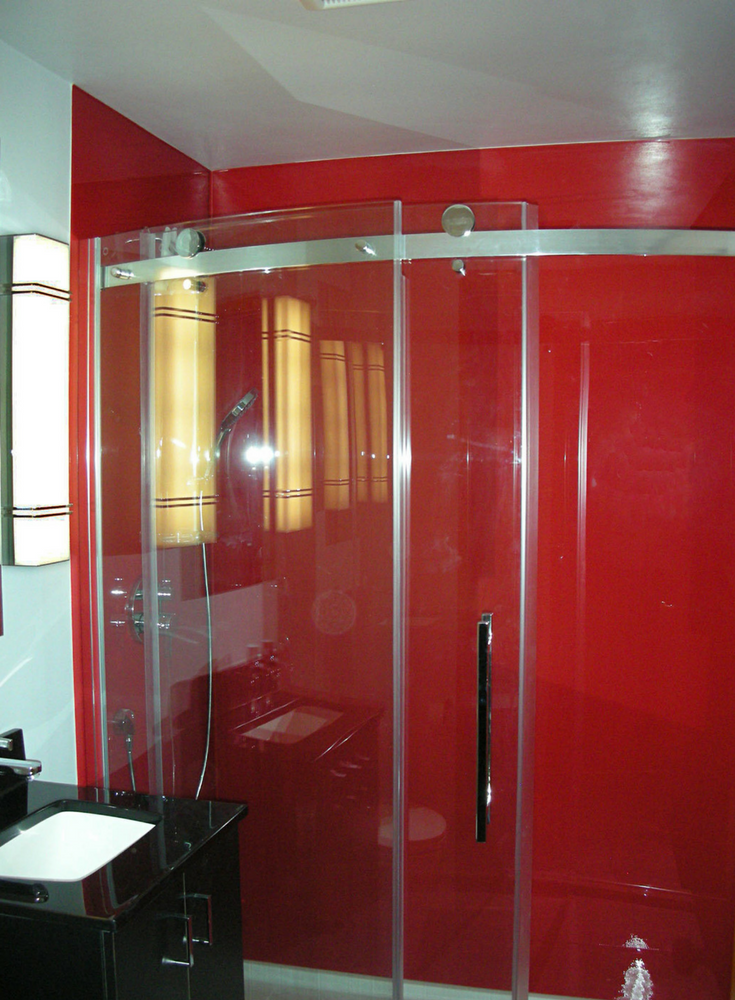 Red high gloss panels and curved frameless glass enclosure