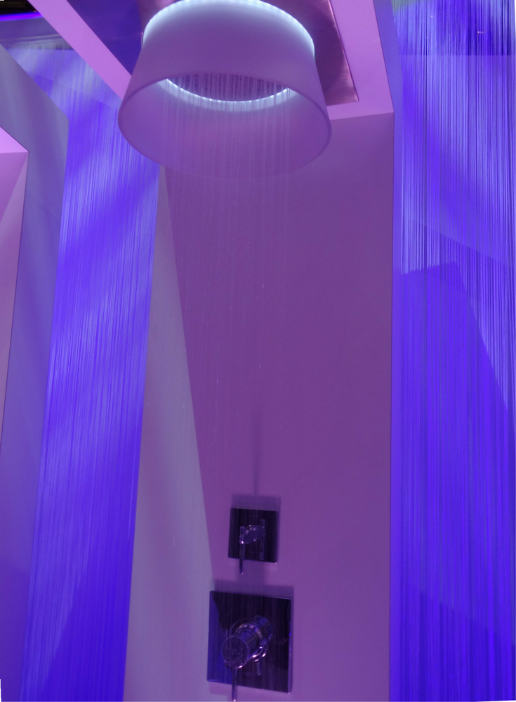 Shower head with blue colored LED lighting | Innovate Building Solutions 