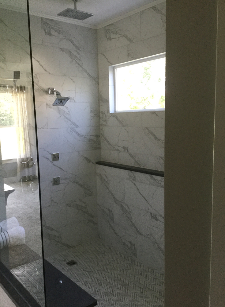 Transom window for better lighting in an aging in place roll in shower | Innovate Building Solutions