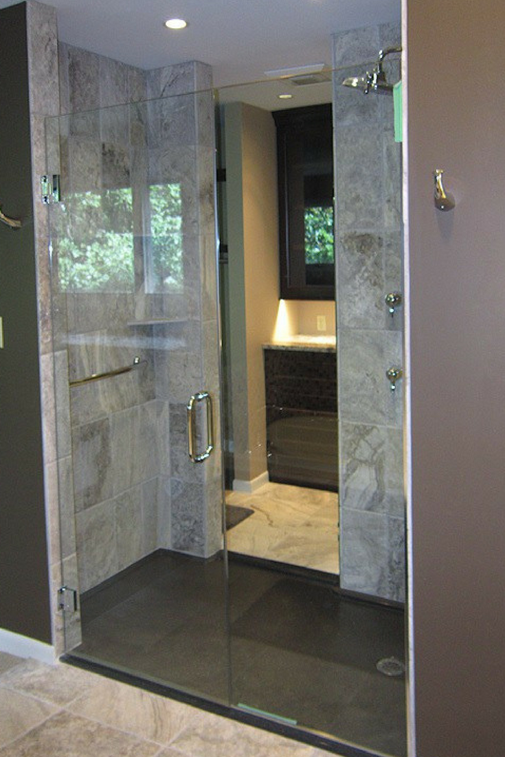 https://blog.innovatebuildingsolutions.com/wp-content/uploads/2017/11/Dark-brown-low-profile-stone-shower-pan-with-a-custom-glass-enclosure.png