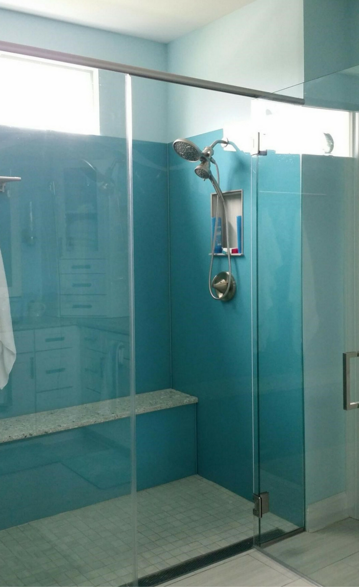 High gloss acrylic shower wall surround panels in a light blue color are simple to clean and look like back painted glass | Innovate Building Solutions 