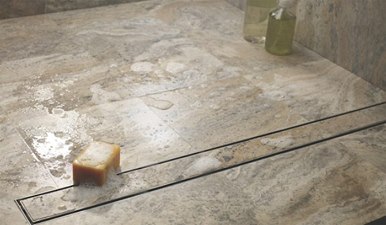 Linear drain in a ready for tile shower pan | Innovate Building Solutions