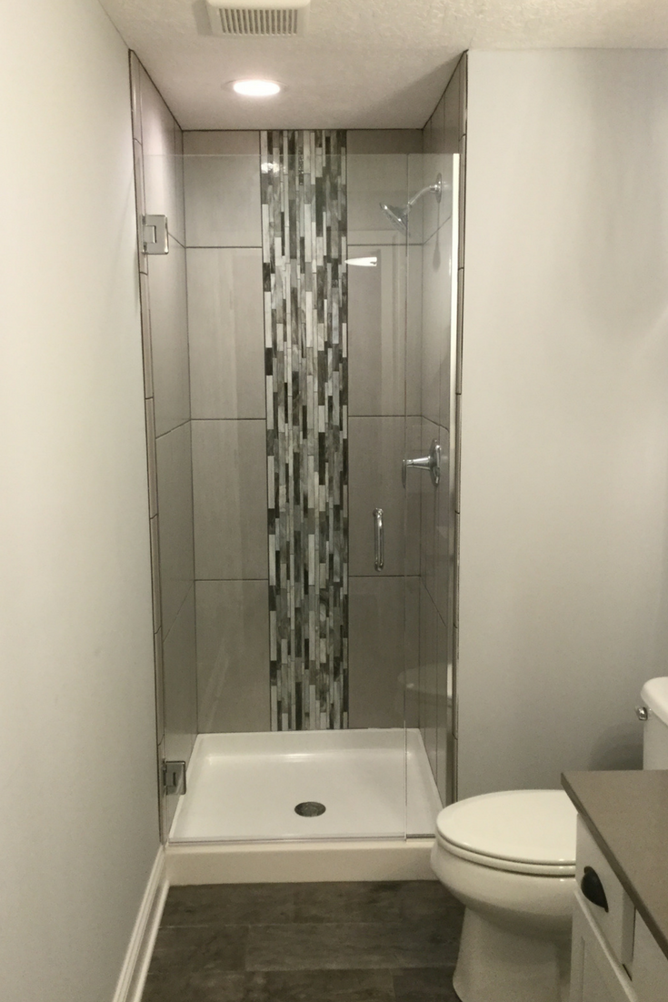 Vertical Shower Tile Wall | Innovate Building Solutions #ShowerSystem #VerticalTile #ShowerSurround