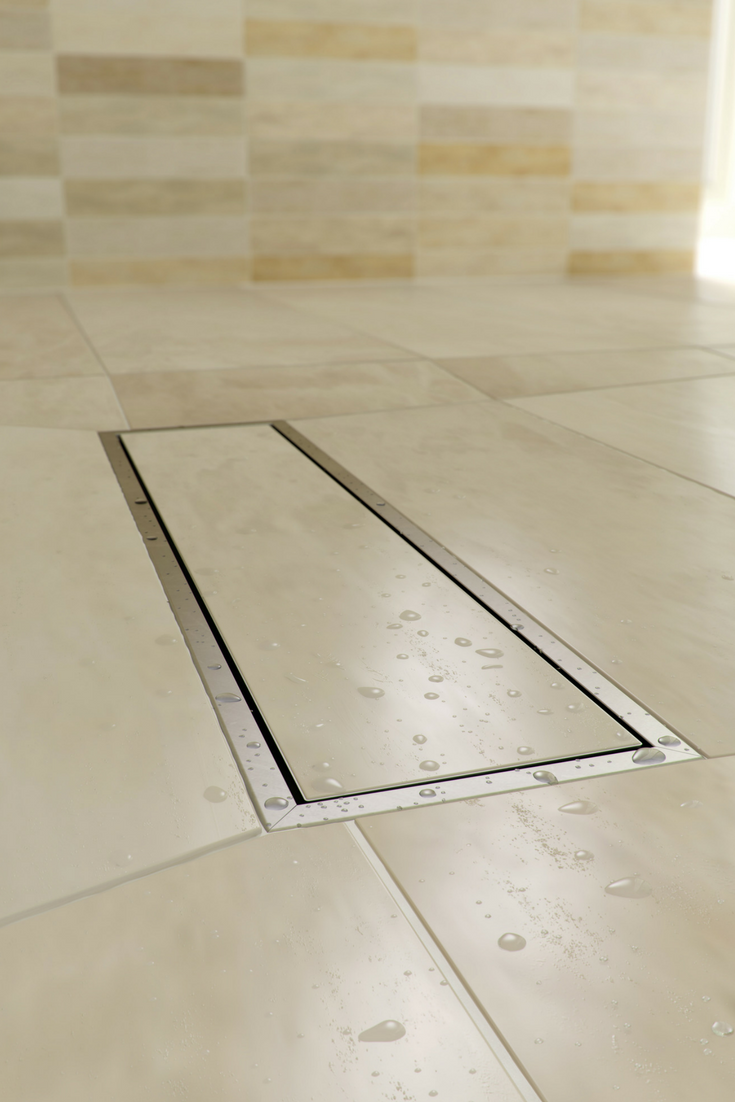 Linear shower drain with large tiles in a contemporary one level tile shower wet room | Innovate Building Solutions #WetRoom #LinearDrain #ShowerDrain