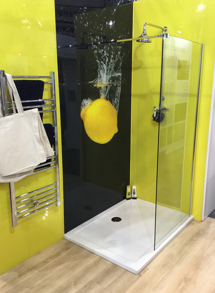 Black and lemon colored high gloss wall panels with a high resolution digital lemon image | Innovate Building Solutions #ShowerPanels #HighGloss #Contemporary #ModernWalls