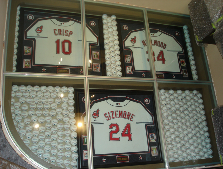 Glass flooring with baseball collector jerseys below | Innovate Building Solutions