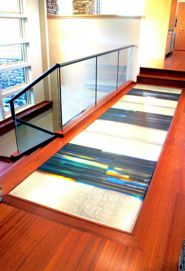 Multi-colored cast glass art bridge in a contemporary home | Innovate Building Solutions 