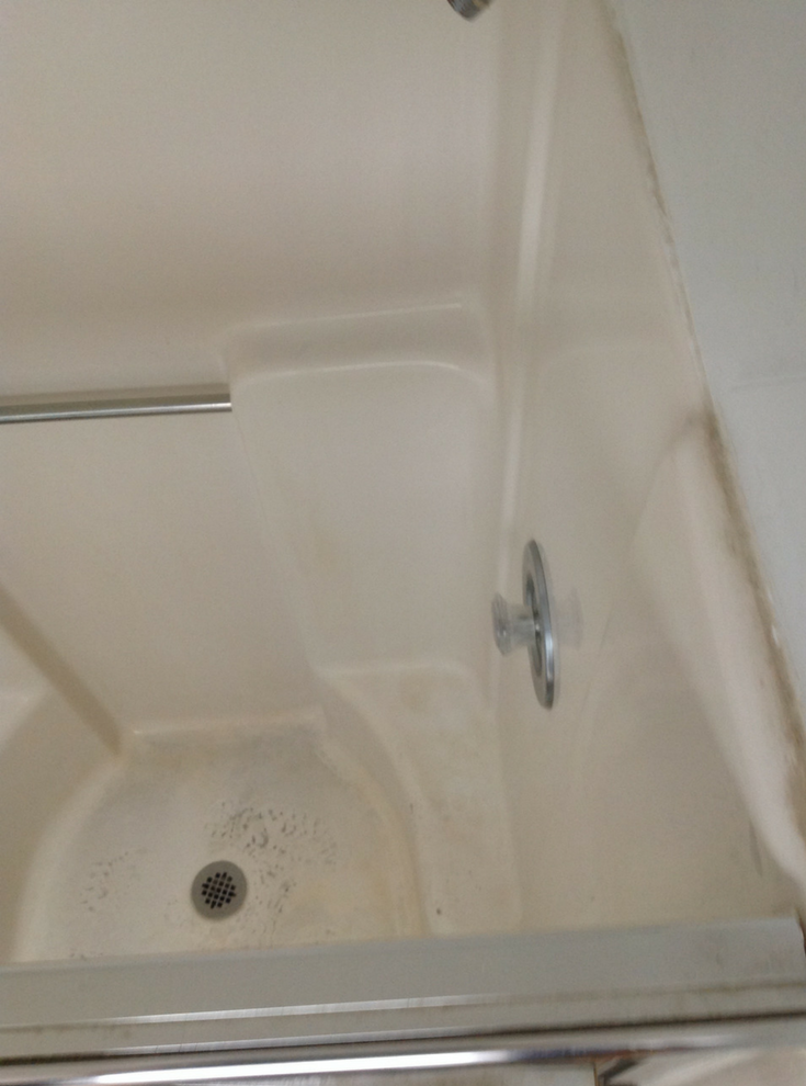ugly fiberglass shower pan | Innovate Building Solutions | #showerpan #BeforePictures #ShoweBase
