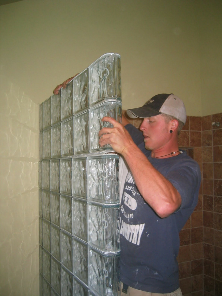 Installing Glass Block Wall That was built in sections | Innovate Building Solutions | #GlassBlockInstall #GlassBlockWall #ShowerWall