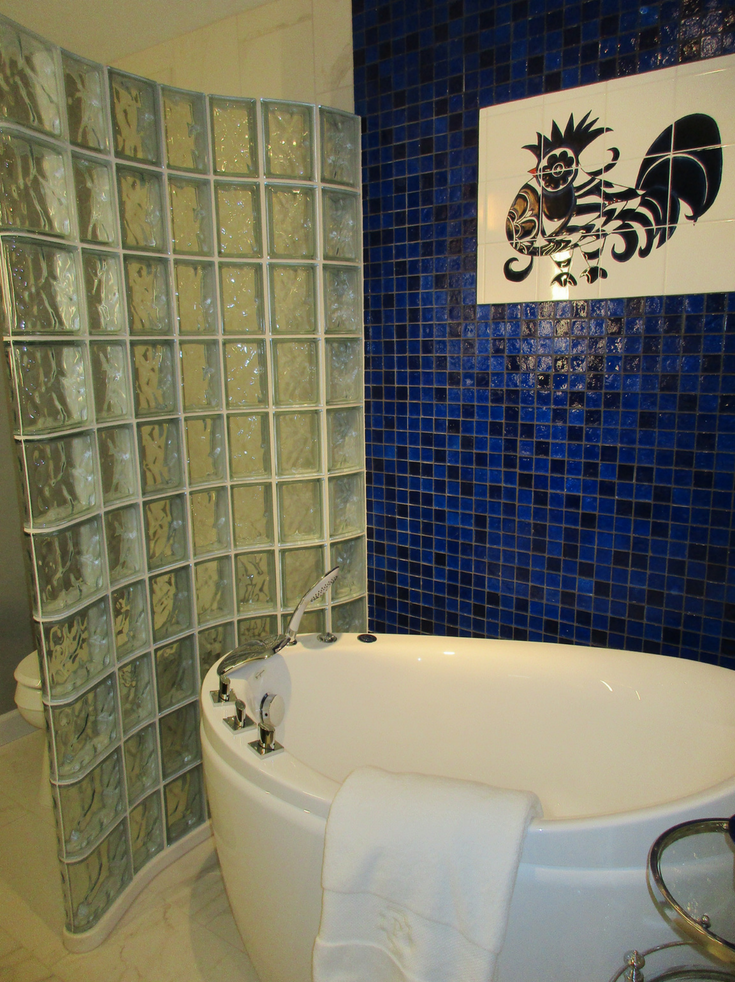 The Bird in the Tile Wall - Glass Block Wall | Innovate Building Solutions | #GlassBlockWall #TileWall #ShowerRemodel