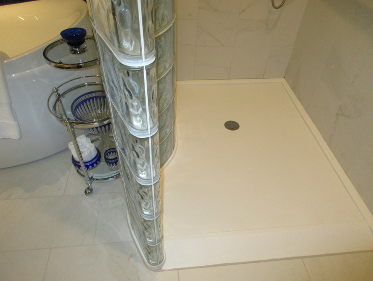 Curved glass block shower base | Innovate Building Solutions | #GlassBlockBase #ShowerBase #GlassBlockShowerWall