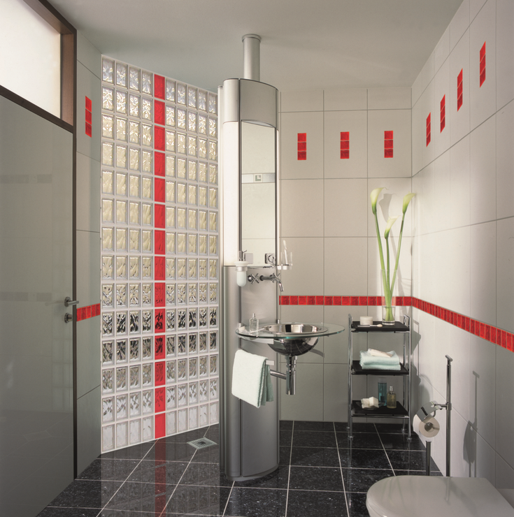 Glass block shower wall with a red vertical stripe | Innovate Building Solutions | #ColoredGlassBlock #GlassBlockInstallation #GlassBlockBase