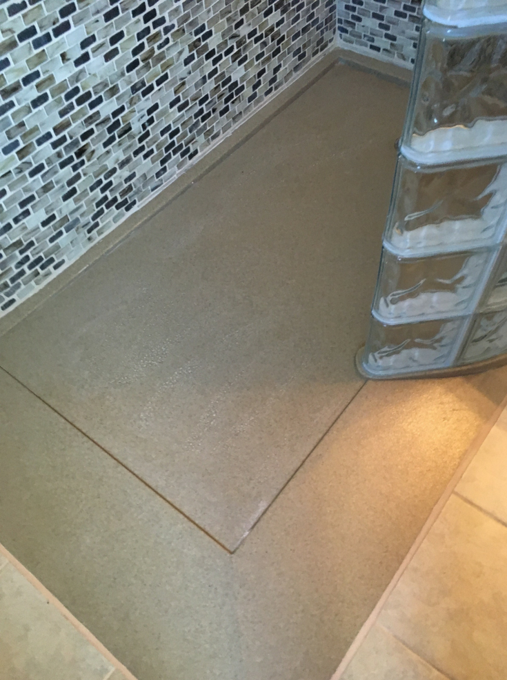 Ramped roll in stone solid surface pan | Innovate Building Solutions | #ShowerBase #StoneBase #ShowerRemodel