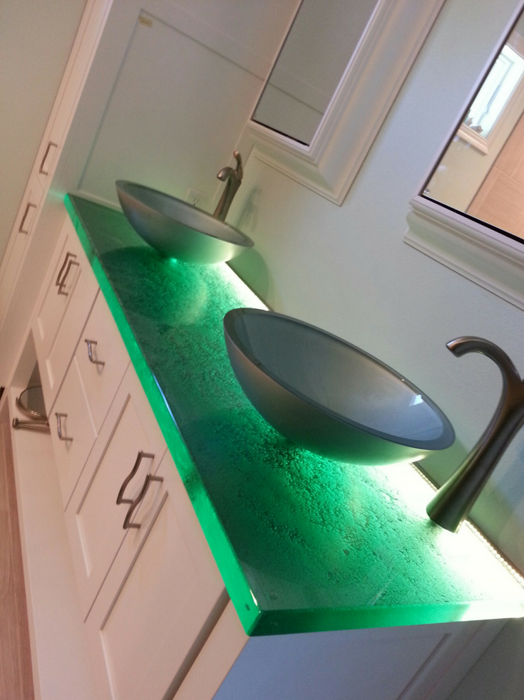 Cast glass vanity countertop with LED lighting | Innovate Building Solutions | #GlassCountertop #BathroomRemodel #VanityTop