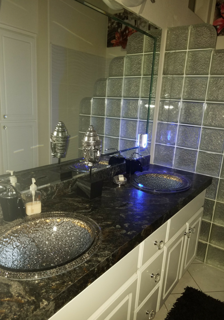 Mettalic leather countertop in a las vegas bathroom | Innovate Building Solutions | #BathroomSink #LeatherCountertop #LasVegasBathroom