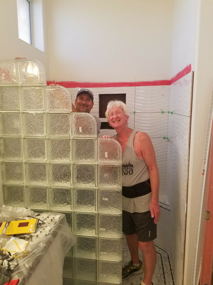 Vic and Mario doing the glass block wall | Innovate Building Solutions | #GlassBlockInstallation #ShowerRemodel #Contractors