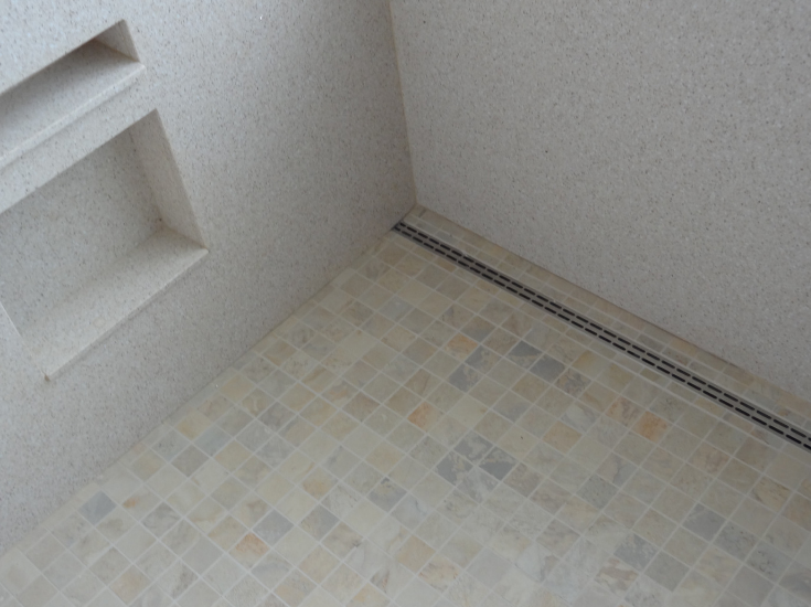 Drain close to the edge of the shower wall | Innovate Building Solutions | #Drain #ShowerDrain #BathroomShower #WalkInShower