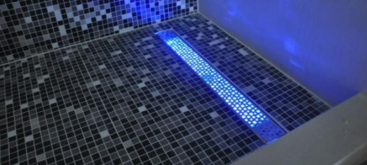 LED lighting in drain from JM Vibro | Innovate Building Solutions | #LEDLight #DrainLight #ShowerDesigns