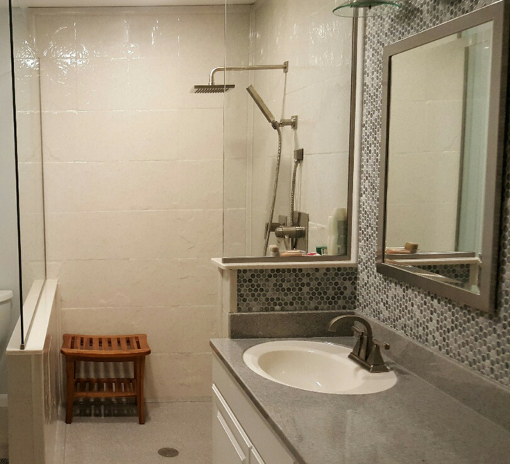 Cultured marble shower pan with a custom drain location | Innovate Building Solutions | #CulturedMarble #ShowerPan #BathroomRemodeling