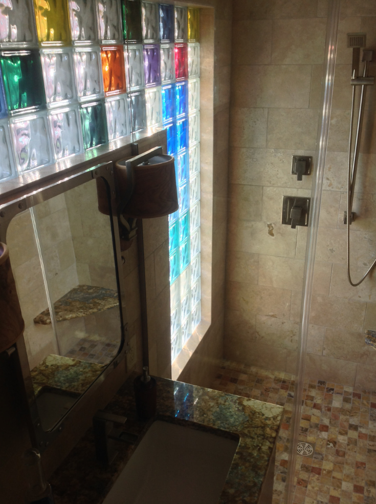 Colored glass blocks in a bathroom shower | Innovate Building Solutions | #ColoredGlassBlock #BathroomWindow #GlassBlockDesign 