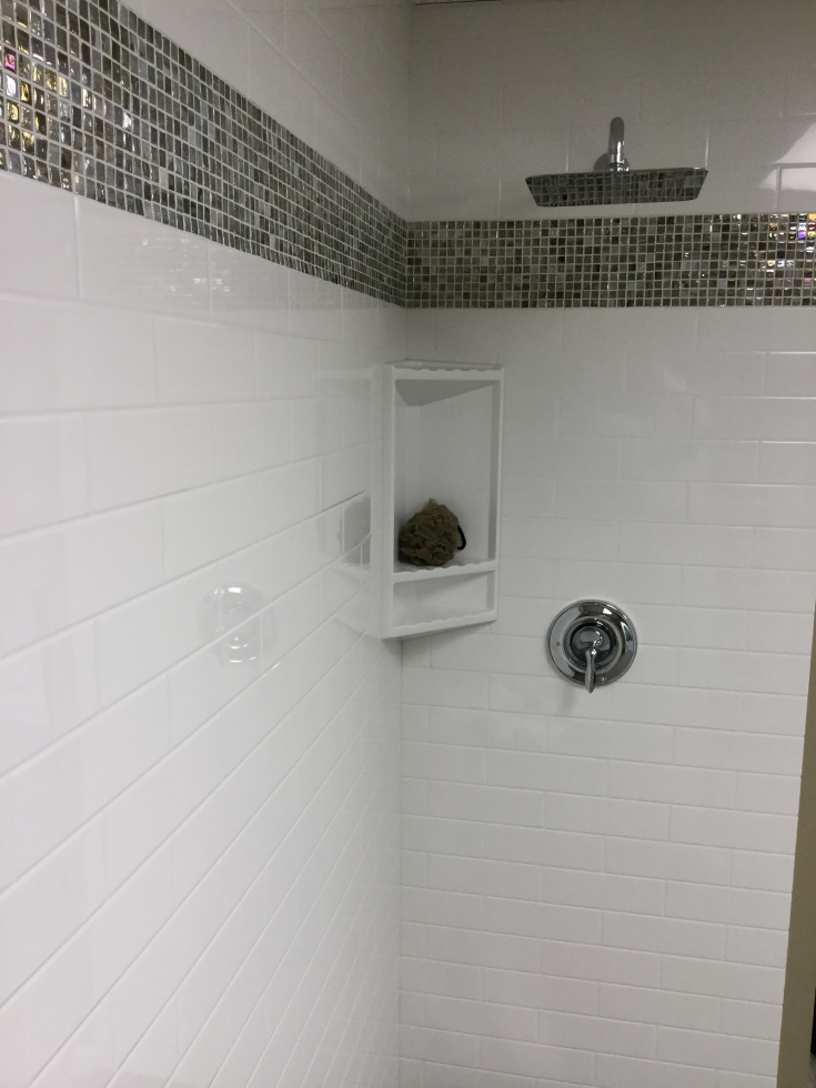 How to Compare Solid Surface & Cultured Stone Shower Systems