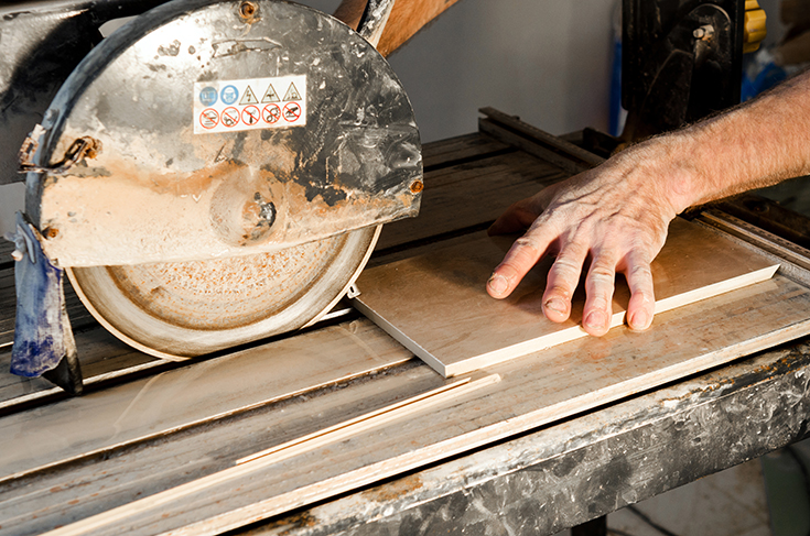 Cutting tiles for a kitchen backsplash wet saw | Innovate Building Solutions | #KitchenBacksplash #CuttingTiles #BacksplashDIY 