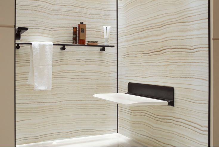 Fold down shower seat for smaller showers | Innovate Building Solutions | #Folddownseat #ShowerSeat #BathroomBench