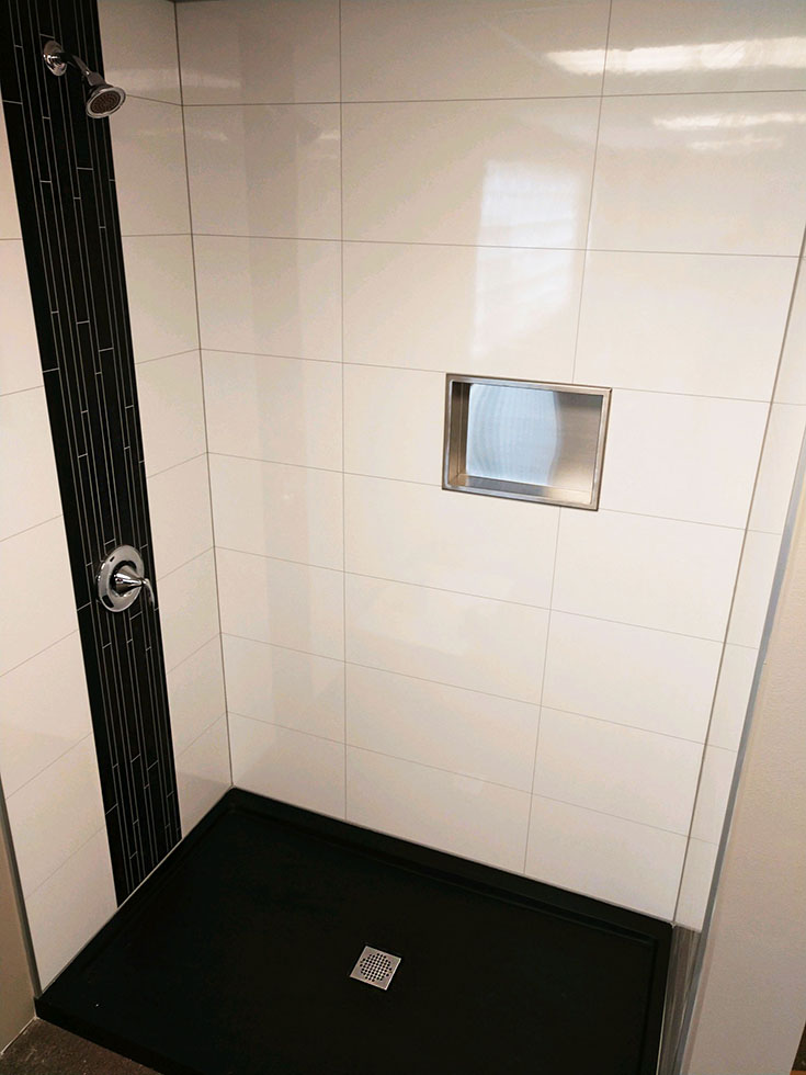 Laminate large format shower wall panels look like tile | Innovate Building Solutions | #bathroomremodel #diybathroom #showerremodelonabudget