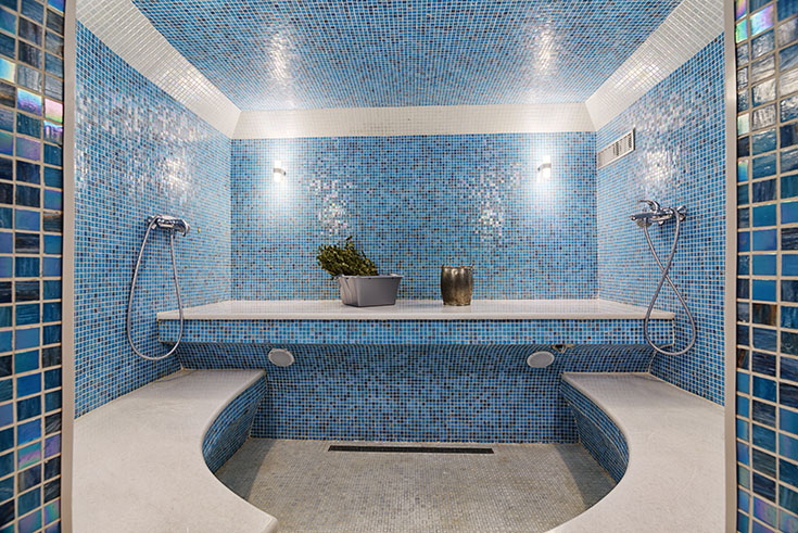 Tile a sauna with blue mosaic tiles | Innovate Building Solutions | #TIledShower #MosaicTIle #Suana 