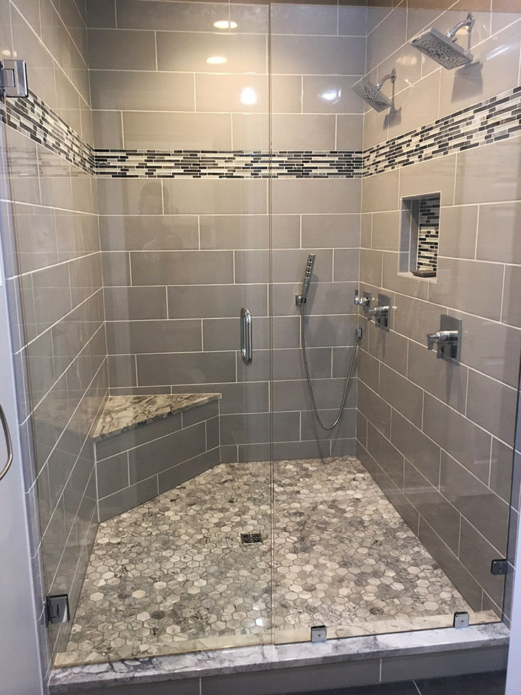 Tile subway tile pattern with a vertical border | Innovate Building Solutions | #Subwaytile #TiledShower #VerticalBorder 