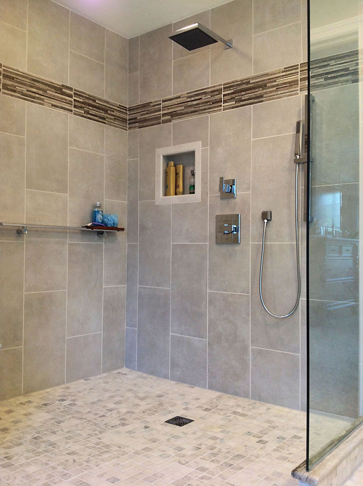 Tile vertical tile border in a wet room shower | Innovate Building Solutions | #verticaltiles #Tiledshower #bathroomremodel