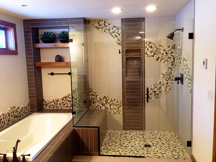 Tile wall patterns spill out into the room | Innovate Building Solutions | #TIledShower #BathroomRemodel #WallPatterns