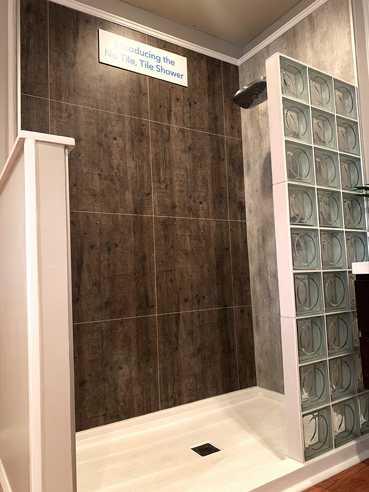 Modern glass block shower with rough wood pattern laminate grout free wall panels | Innovate Building Solutions | #GlassBlockWall #LaminateWallPanels #GlassBlockWall 