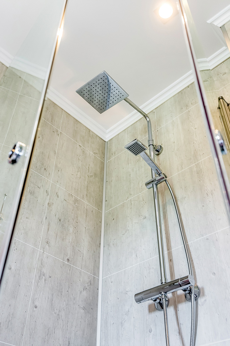 Rain shower head and laminate shower wall panels | Innovate Building Solutions | #ShowerHead #RainShower #BathroomRemodel #LaminateWallPanels