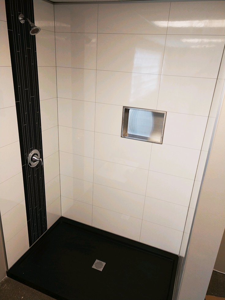 Stainless steel niche in laminate shower wall panel surround system | Innovate Building Solutions | #laminatewallpanels #ShowerWallpanels #ShowerSurround #SoupHolder
