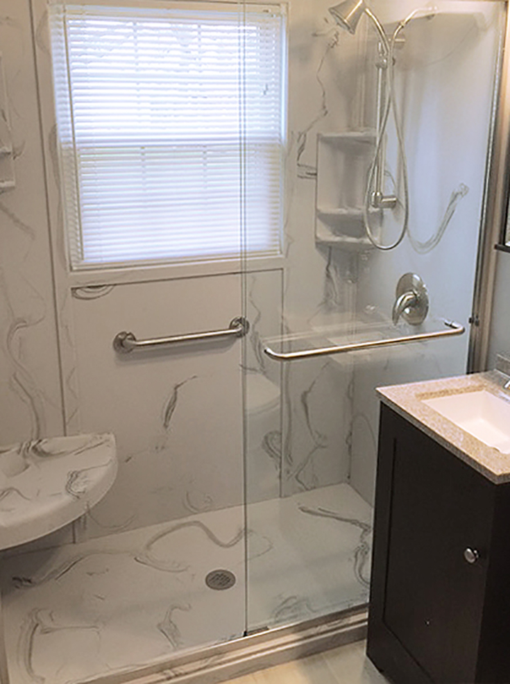 Gray and white swirl custom cultured stone shower base | Innovate Building Solutions | #CustomBase #ShowerPan #CulturedStone #GrayandwhiteshowerBase