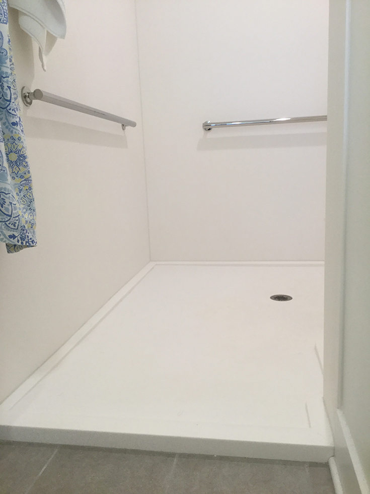 Matte white custom cultured stone solid surface shower pan | Innovate Building Solutions | #CulturedStone #SolidSurfacePan #ShowerPan #Mattewhitebase