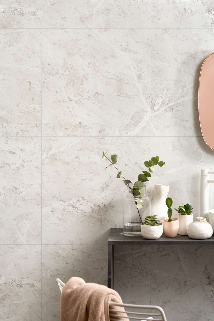 White marbelized laminate bath and shower wall panels | Innovate Building Solutions | #WhiteMarbel #BathroomRemodel #ShowerWallPanels 