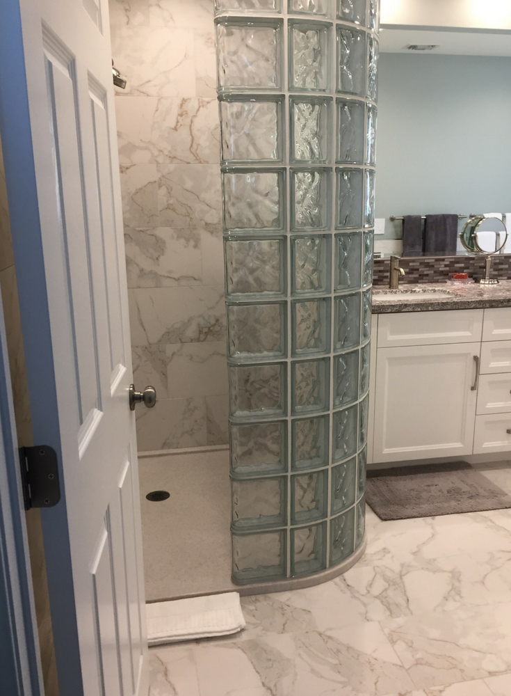 How to Compare Solid Surface & Cultured Stone Shower Systems