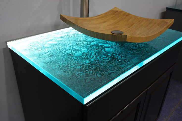 Cast glass countertop with a vessel sink | Innovate Building Solutions | #GlassCountertop #VesselSink #ShowerSink