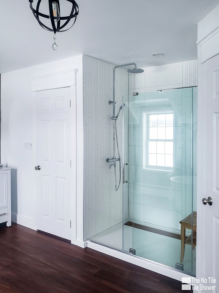 white faux tile look laminate shower wall panels | Innovate Building Solutions | #TileShower #FauxTile #Showerwallpanels
