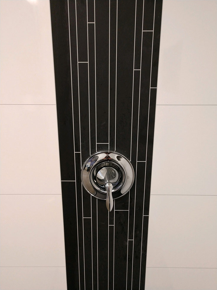 Laminate shower panels with realistic faux grout joints | Innovate Building Solutions | #DecorativeShower #AccentWall #LaminateShowerPanels #NoGrout