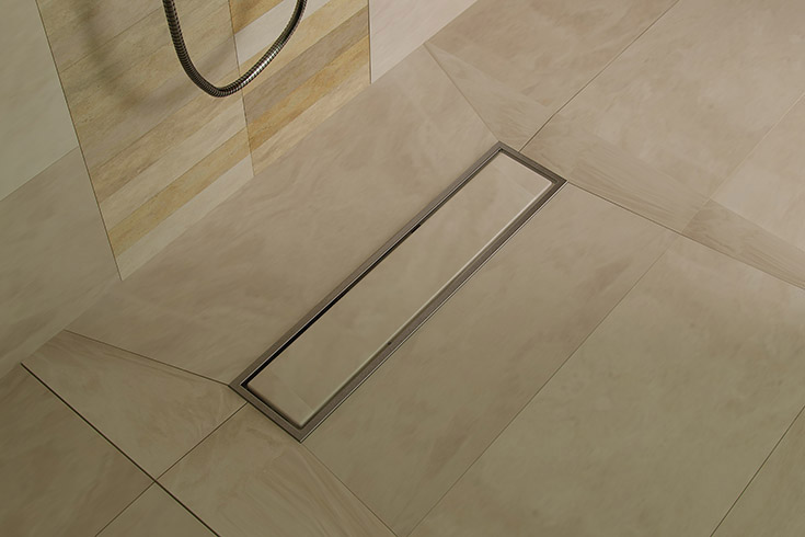 Large format custom tile shower floor pan | Innovate Building Solutions | #SolidSurface #LinearDrain #ShowerFloor #TileShower