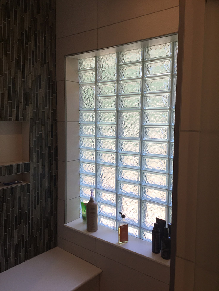 glass block high privacy shower window with different sized blocks | Innovate Building Solutions | #GlassBlockWindow #ObscureGlass #PrivacyGlass #BathroomWindow 